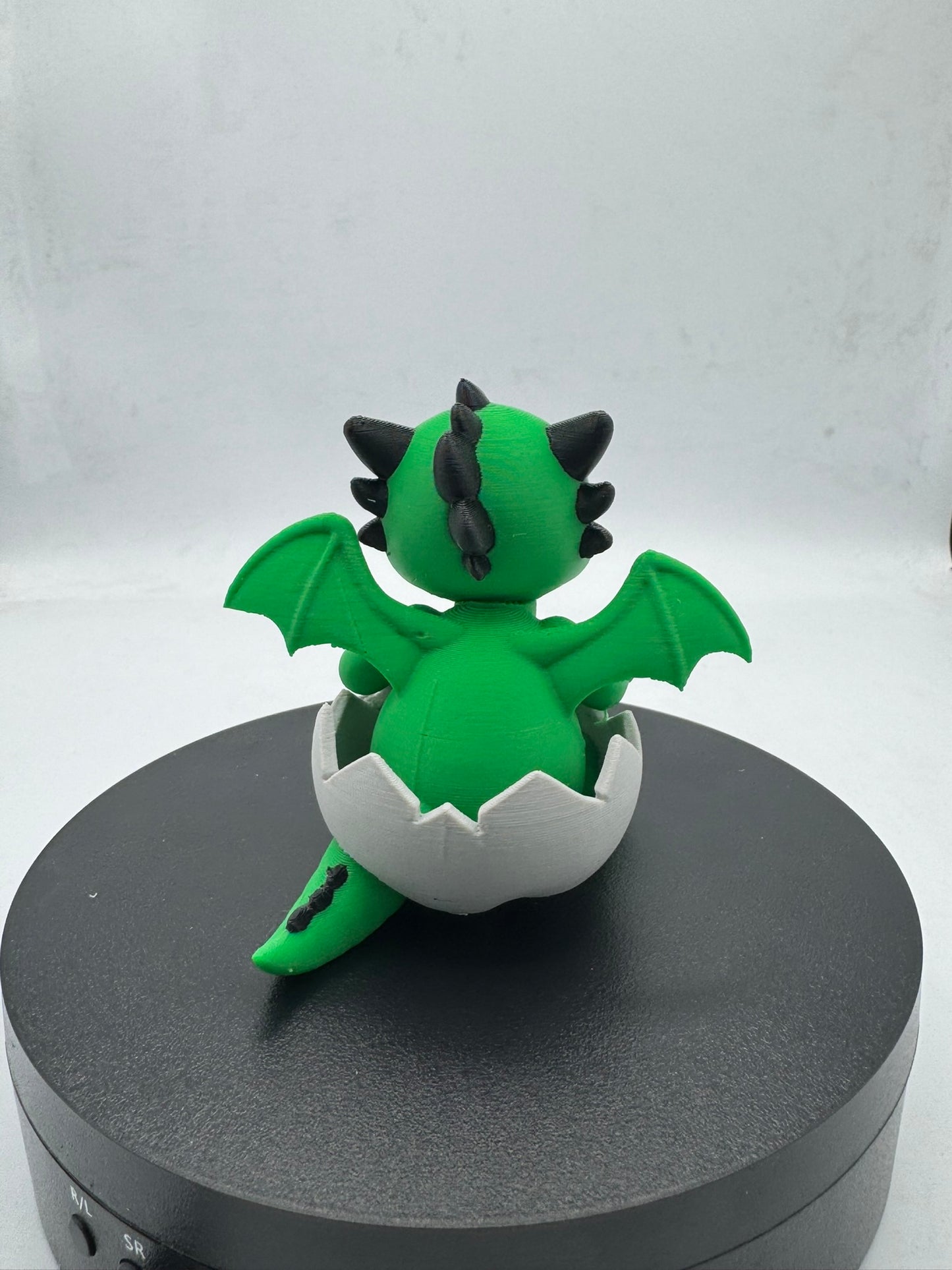 Cute Chibi Baby Dragon Hatchling Sitting in Egg